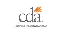 California Dental Association logo with gray cda text and orange accent above the letters