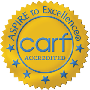 A seal that says aspire to excellence carf accredited