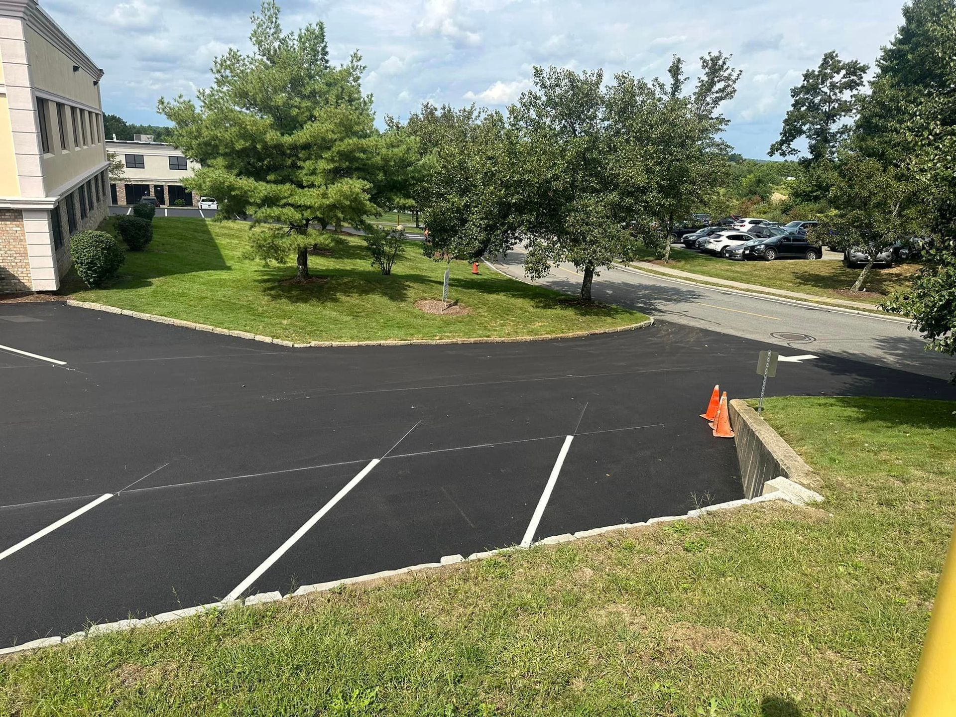 a parking lot with a building in the background