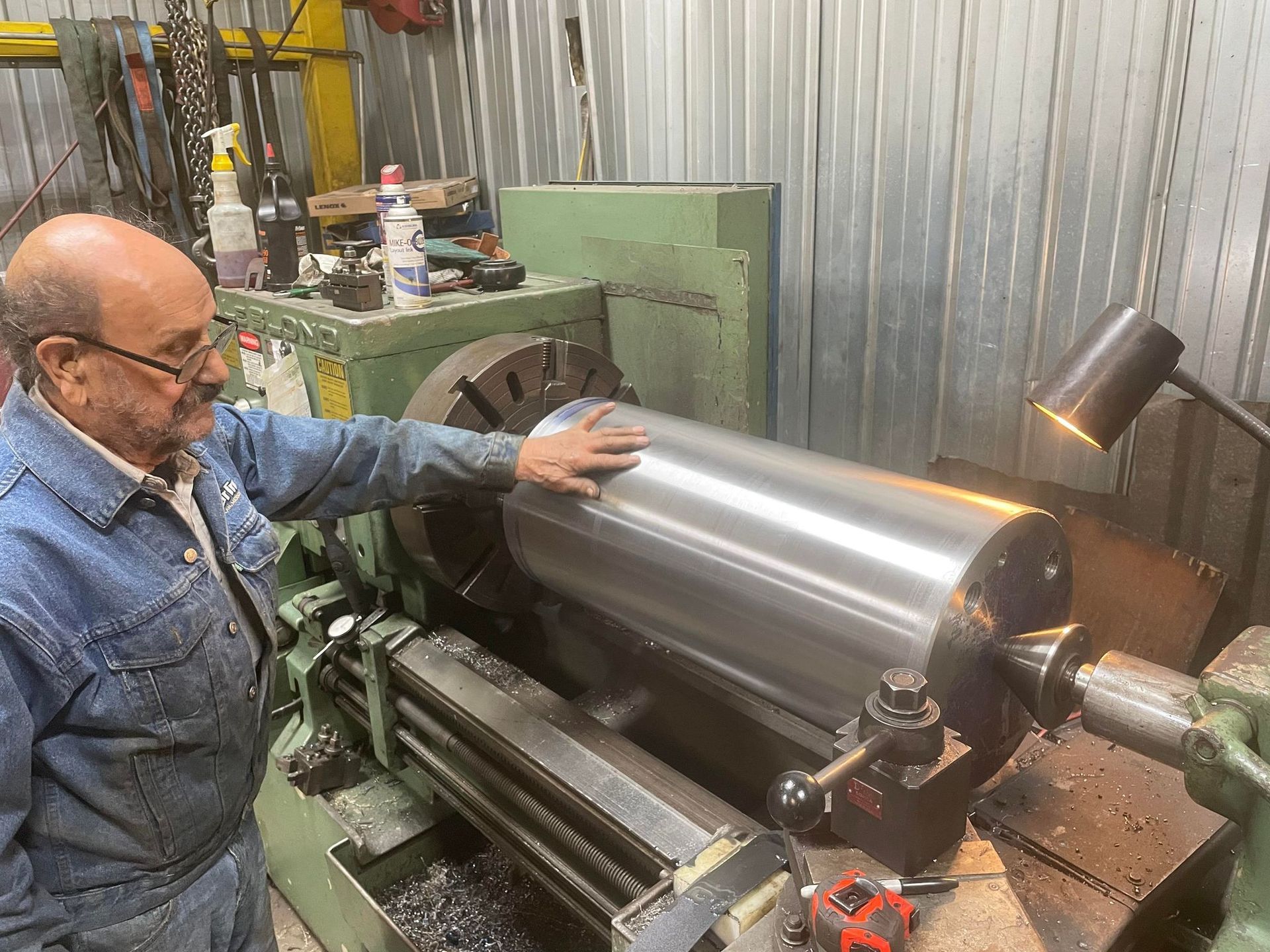 Man touching cylinder metal