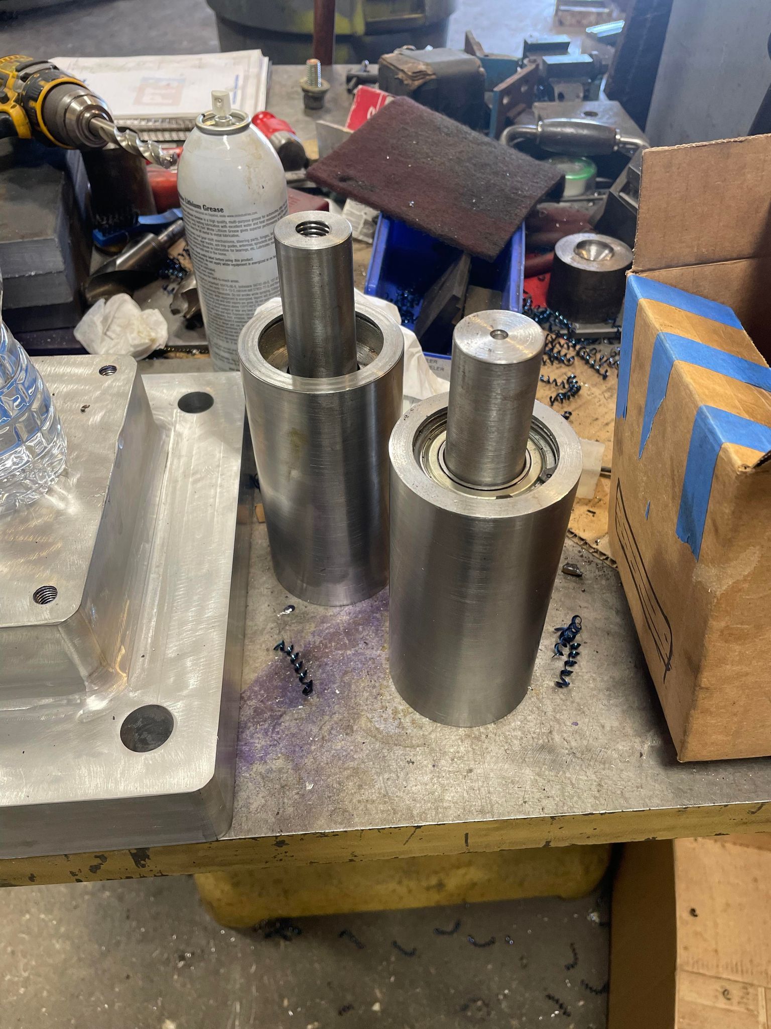 Two custom metal parts