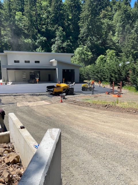 A construction site with a large building in the background