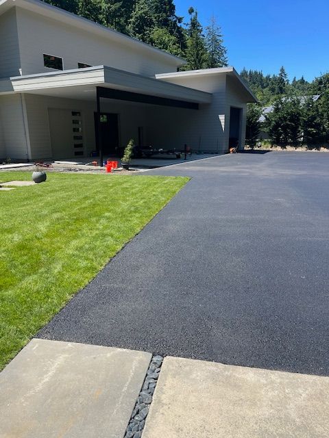 A house with a large driveway leading to it