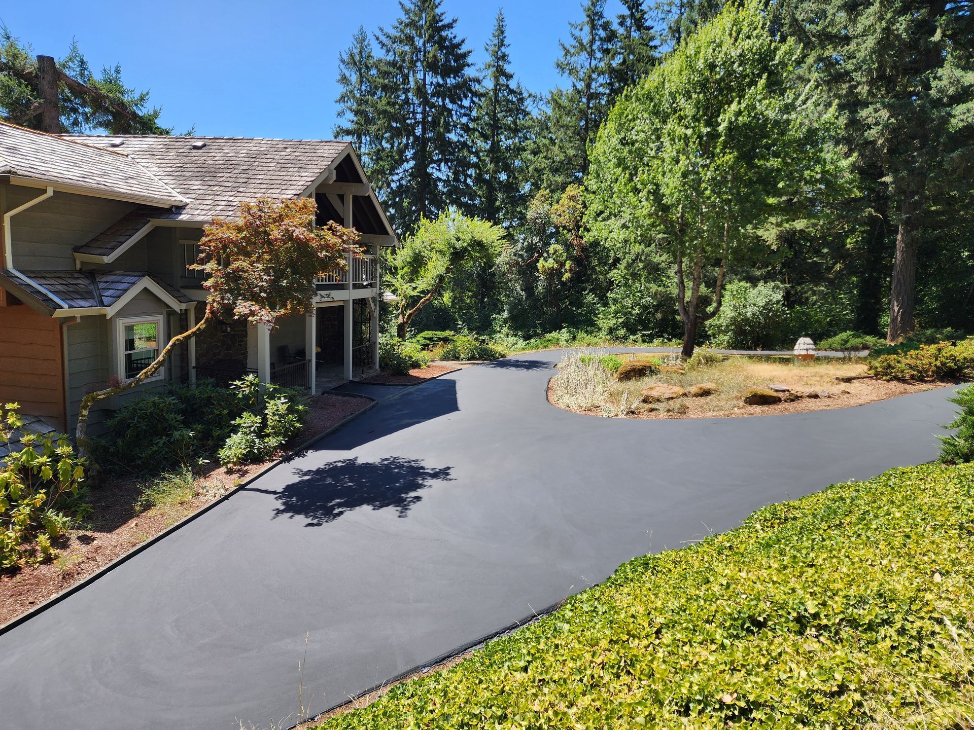 A large house with a large driveway leading to it