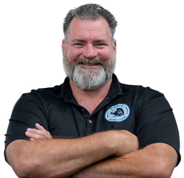 Smiling bearded man in a black polo shirt with crossed arms against a white background