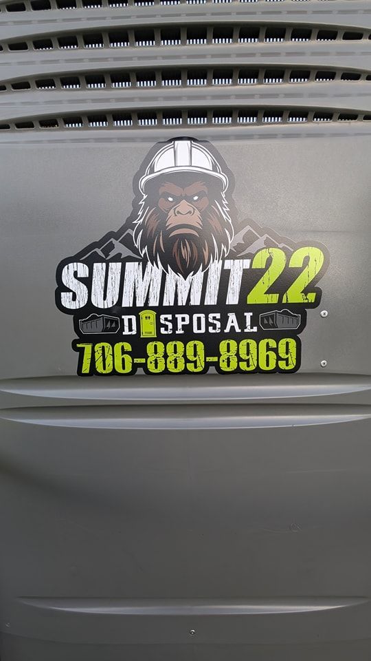 The logo for summit 22 disposal is on the side of a trash can.