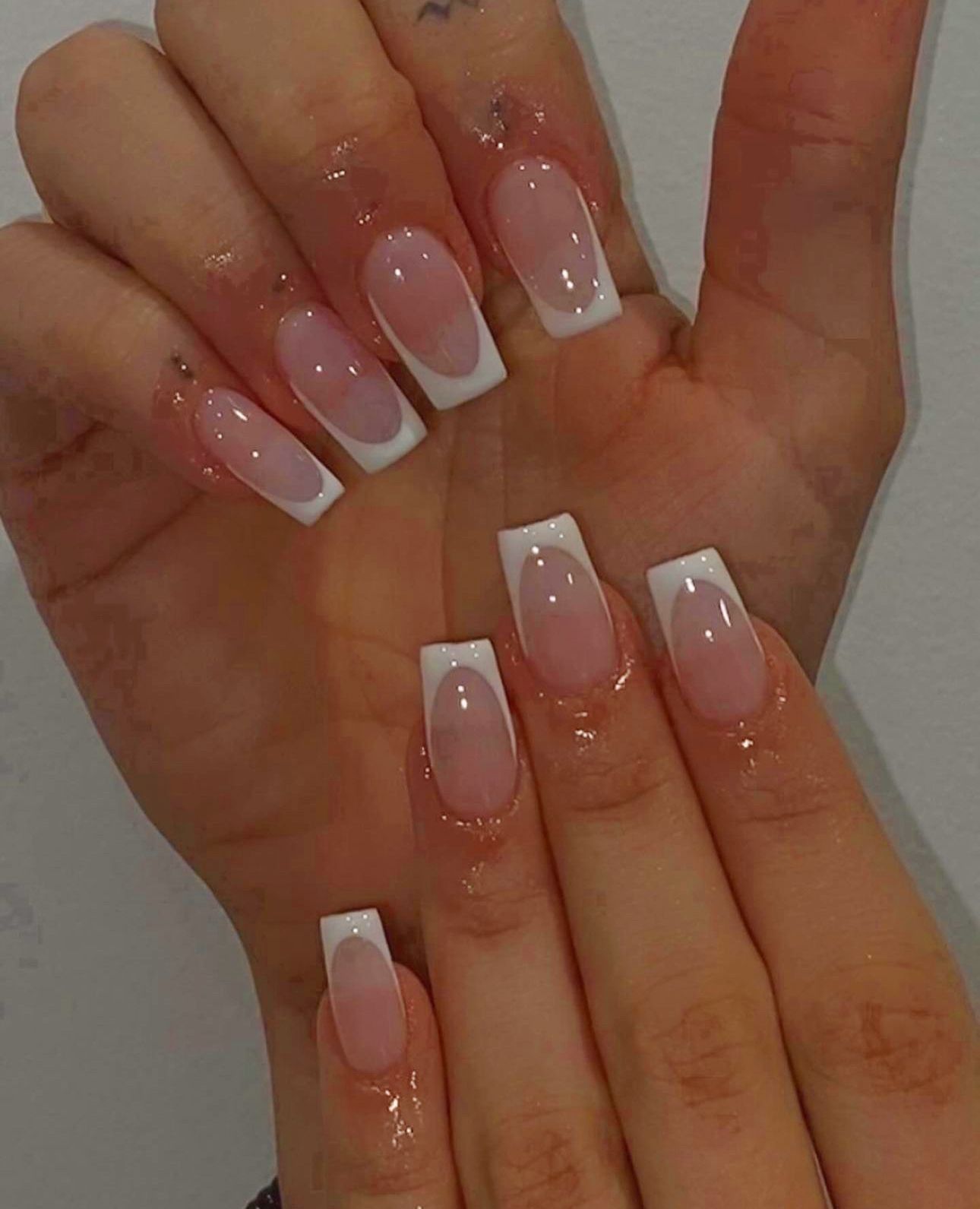 French tip square nails with a nude base.