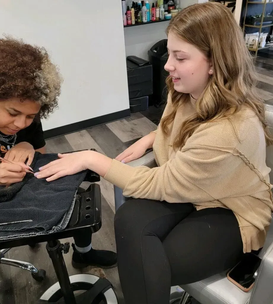 Person having a manicure at a salon