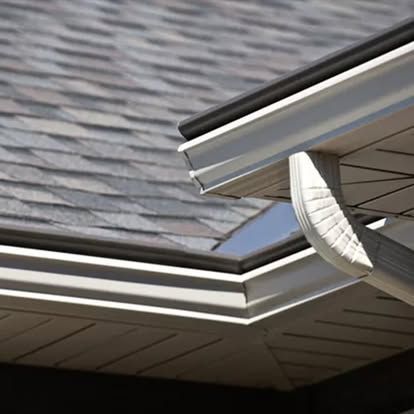 a close up of a gutter on a roof of a house