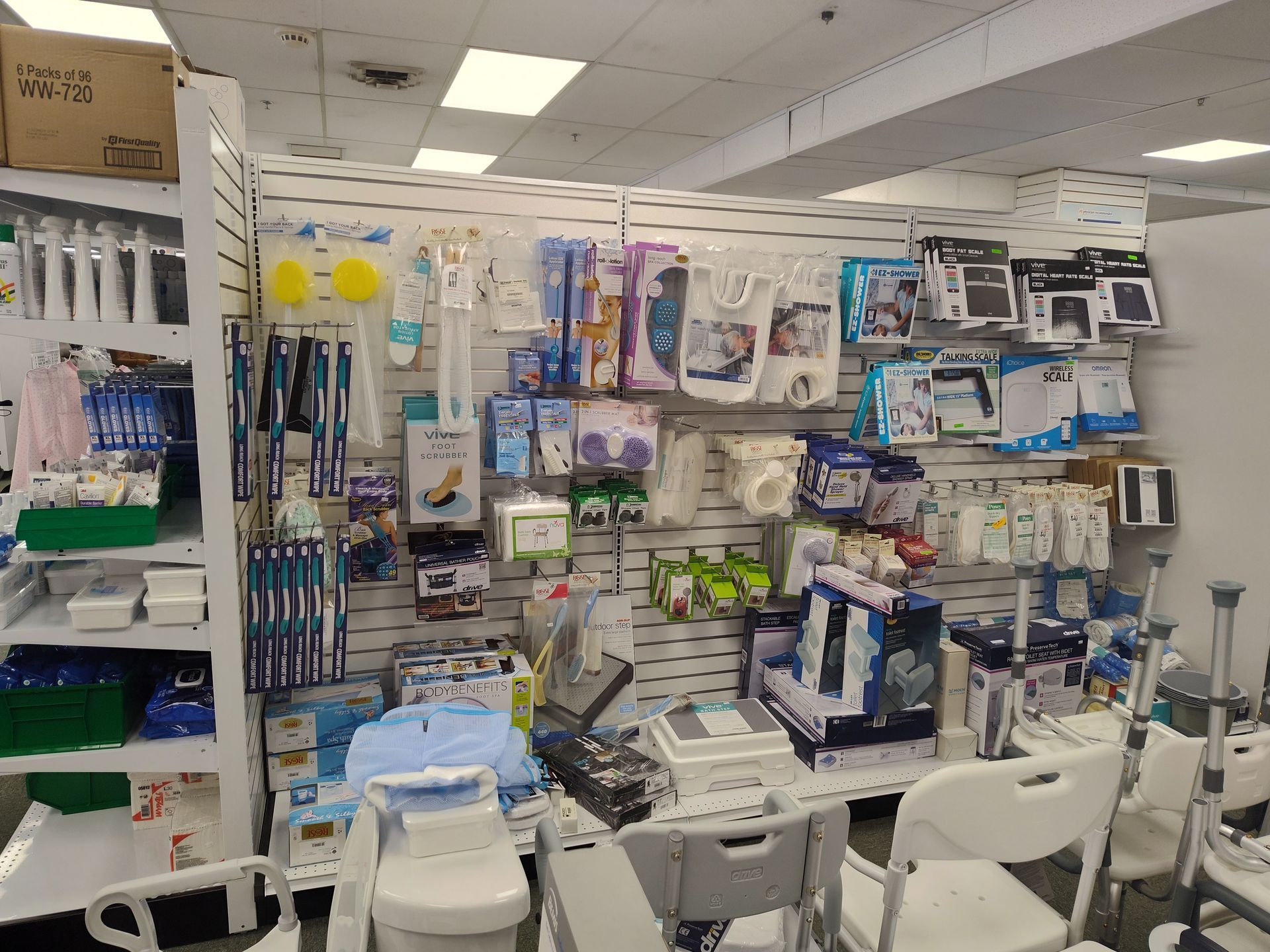 Medical supply store display with hygiene products and mobility aids.