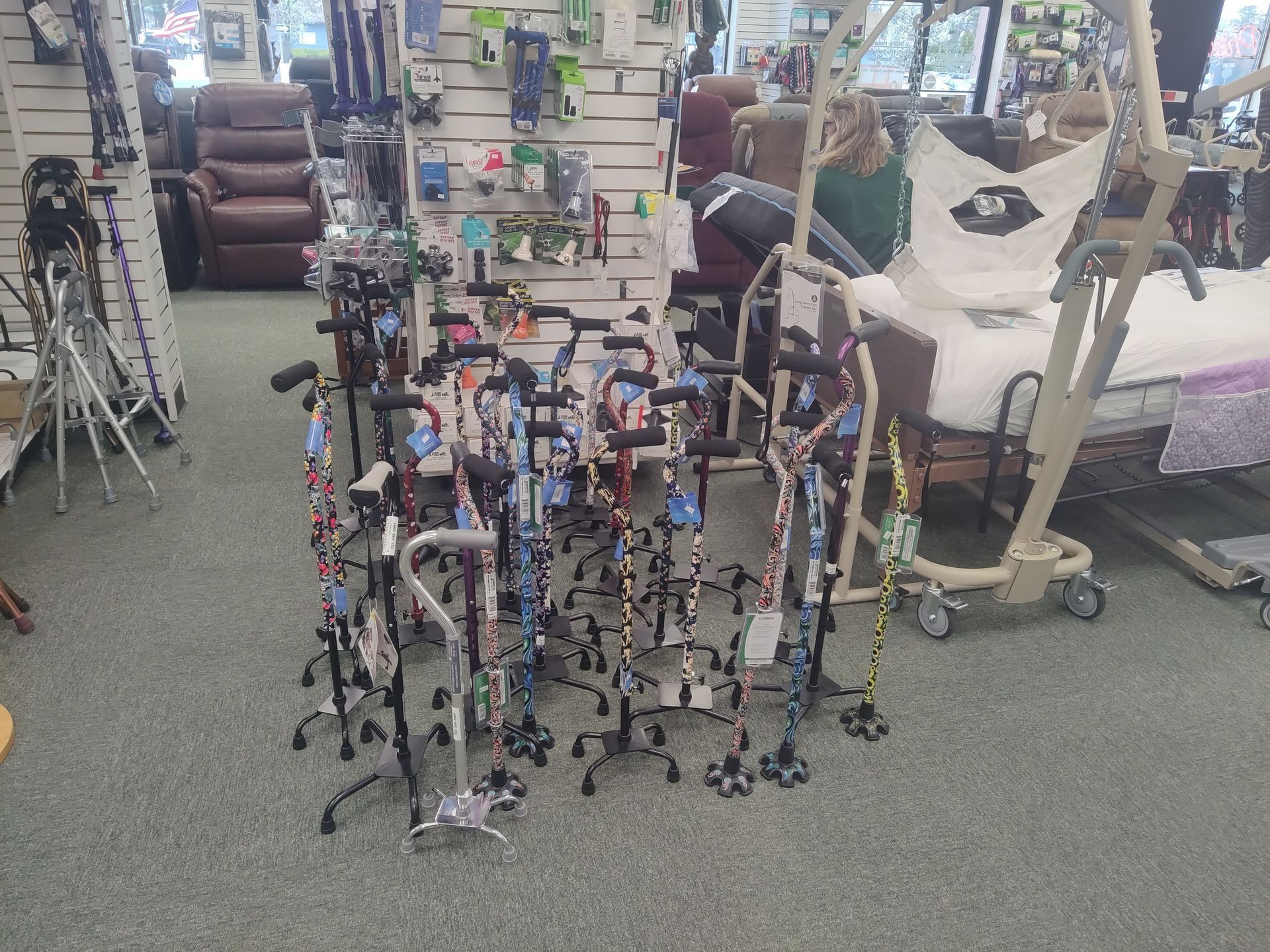 Medical supply store interior with display of walking canes and a patient lift.