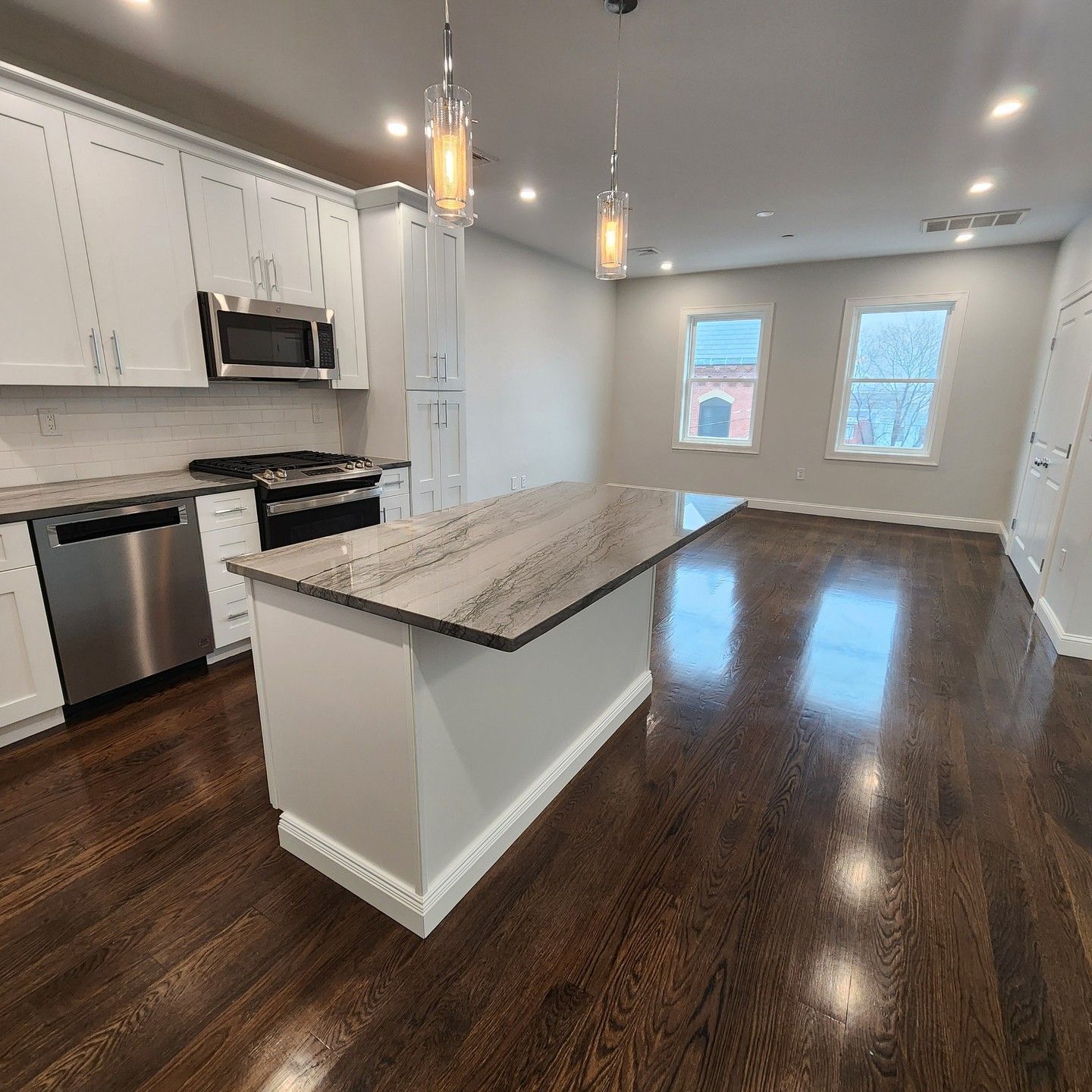 a kitchen with a large island in the middle of the room