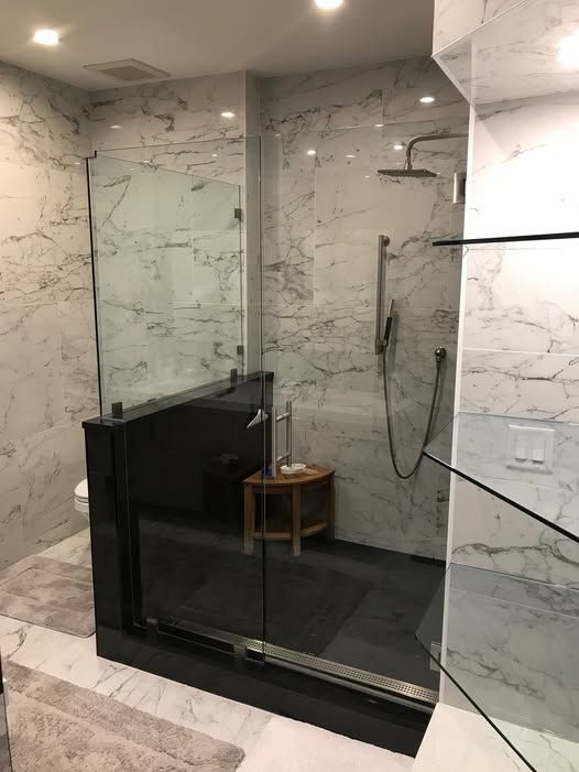 a bathroom with a walk-in shower and a toilet