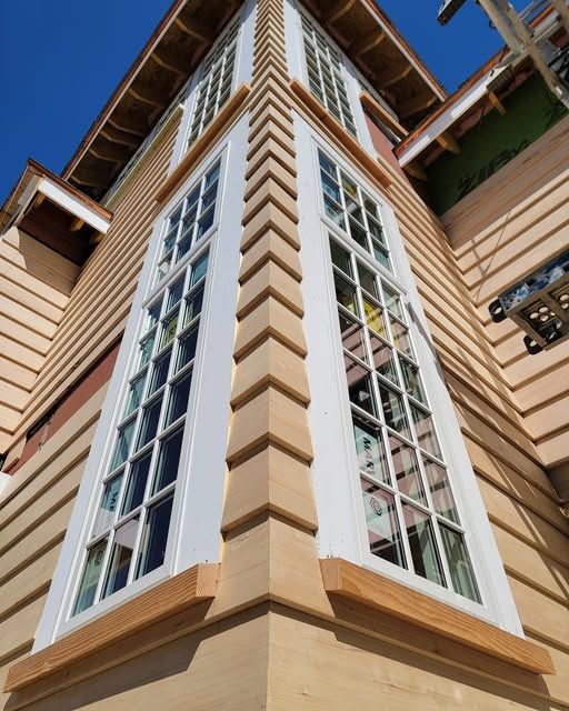 the corner of a building with many windows