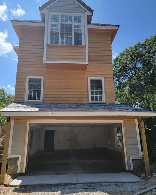a large house with a garage underneath it