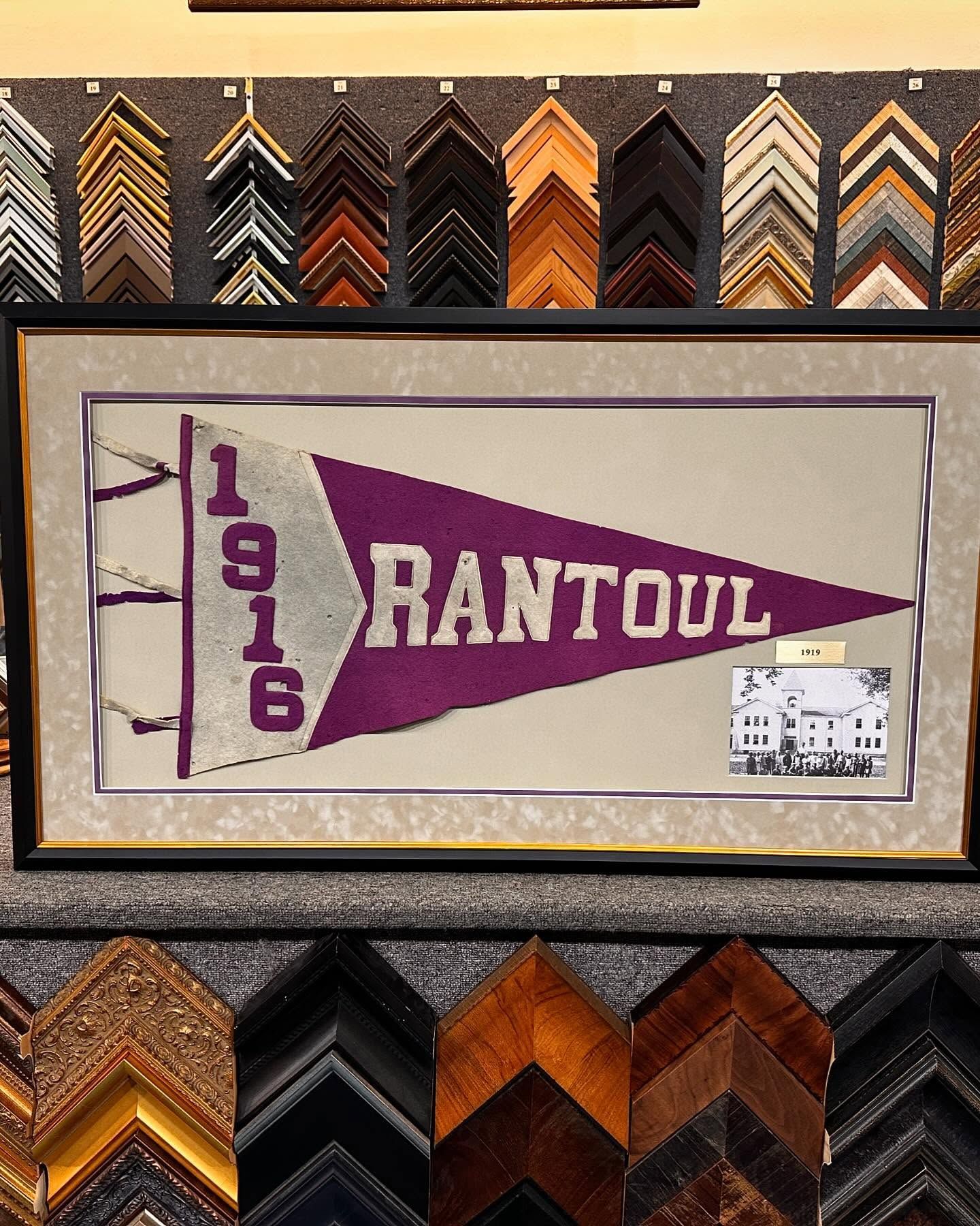 Framed vintage Rantoul banner (1916) in purple and white, surrounded by frame samples.