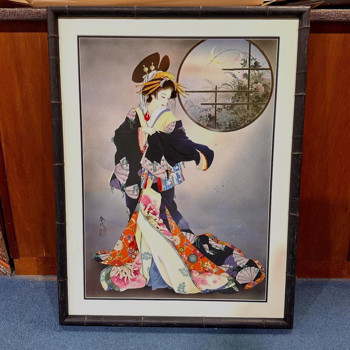 Geisha in ornate kimono, framed artwork. Holds a fan near a circular window, neutral tones with pops of color.