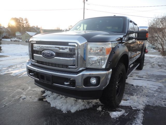 Black Ford truck repaired - left quarter view