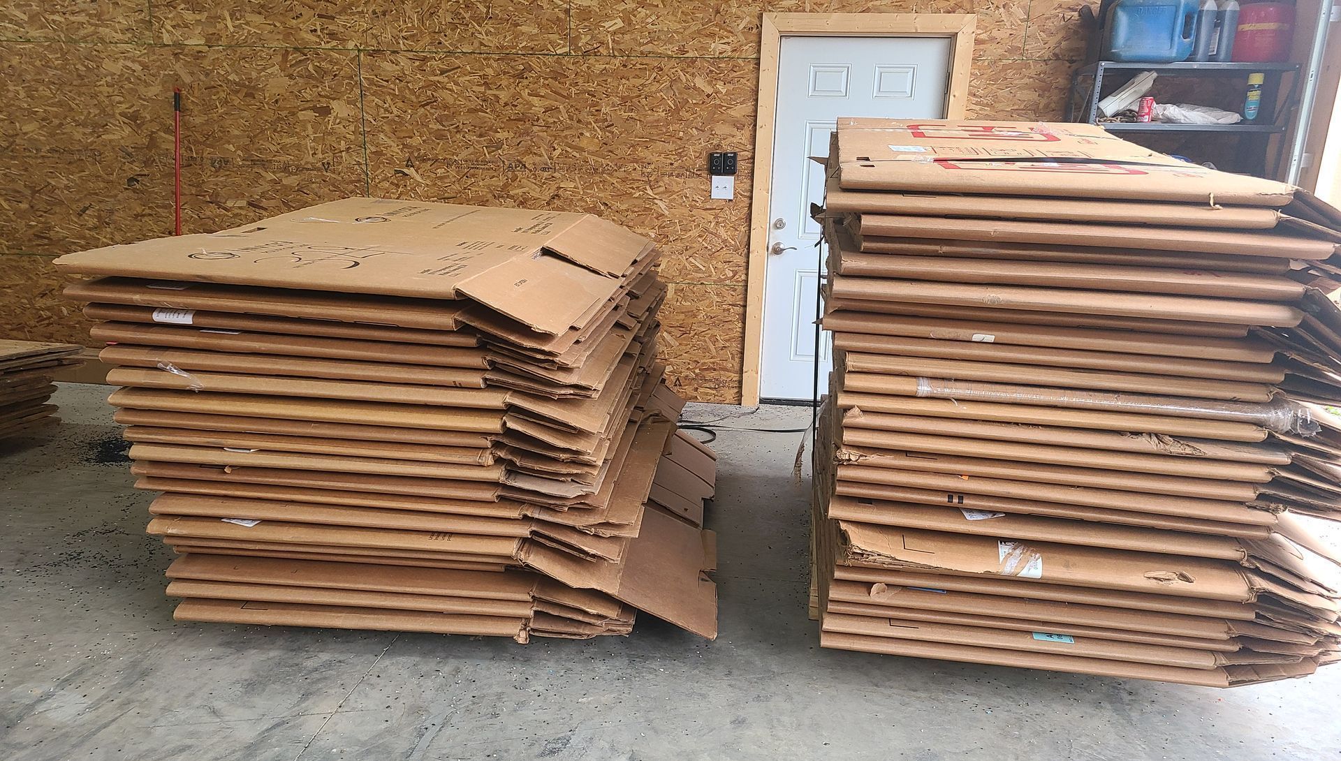 Two stacks of cardboard boxes are sitting next to each other