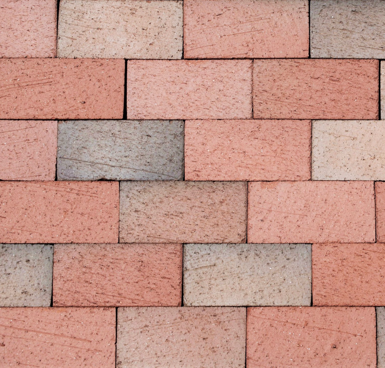 Pink and gray brick pavement pattern