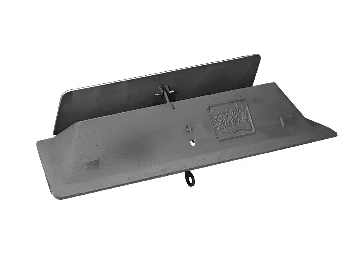 Gray plastic wall-mounted device with a slanted black panel and small hanging loop underneath.