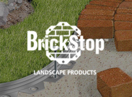 BrickStop landscape products logo over grass, stone, and brick pavers