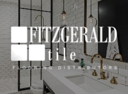 Fitzgerald Tile logo over a modern bathroom with white marble sink and gold fixtures