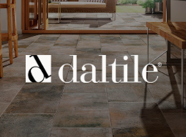 Daltile logo over a tiled indoor floor with a dining area in the background