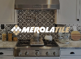 Modern kitchen with stainless steel range and bold black-and-white patterned tile backsplash, MEROLATILE logo overlay