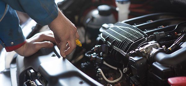 a man is working on a car engine