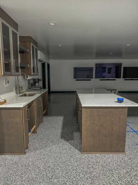 A kitchen with a large island in the middle of the room.