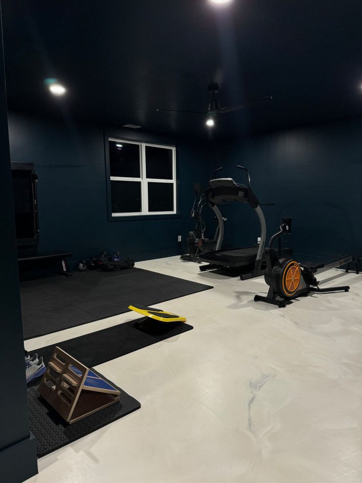 There is a treadmill in the middle of the room.