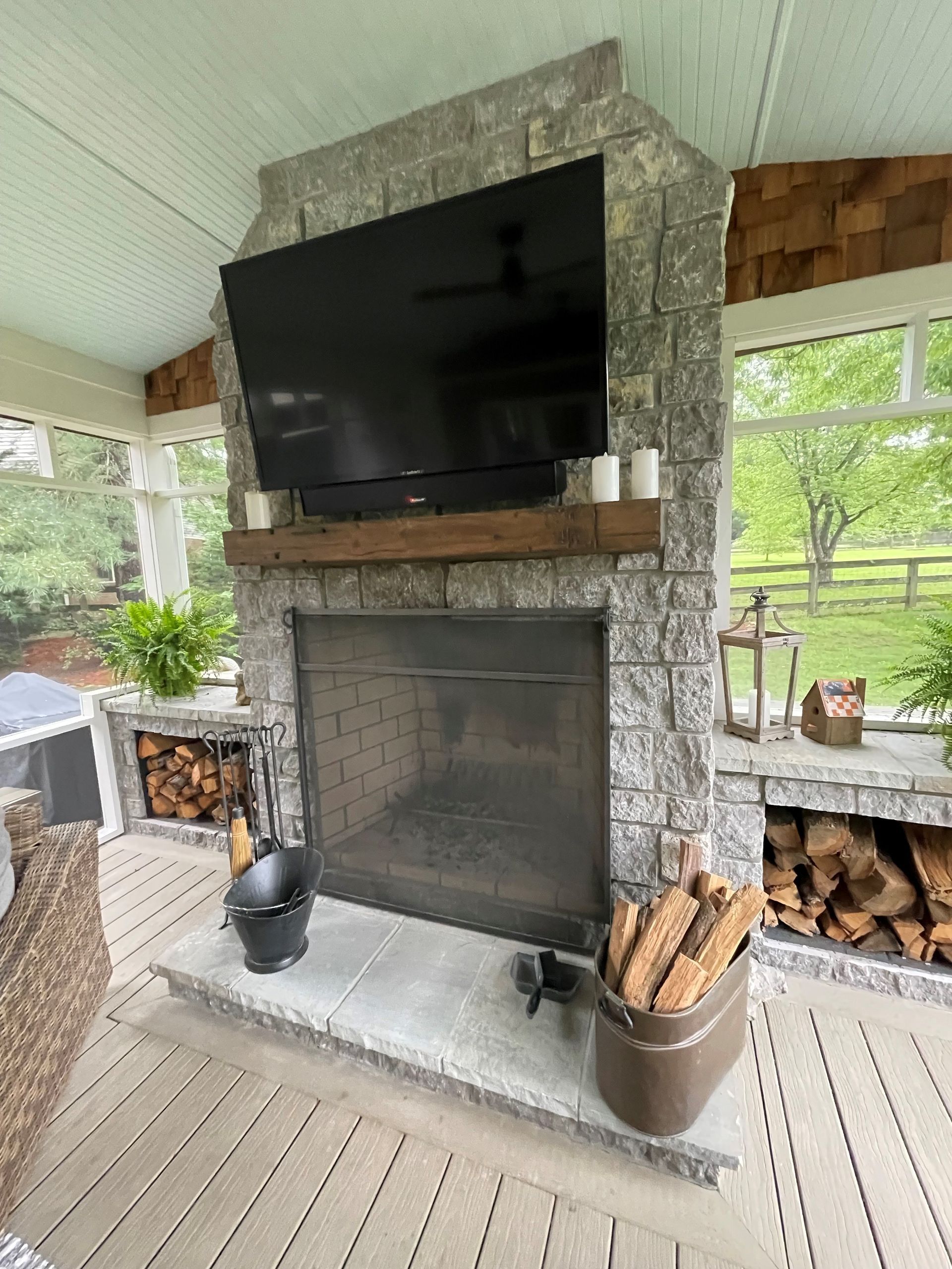 There is a fireplace with a flat screen tv above it.