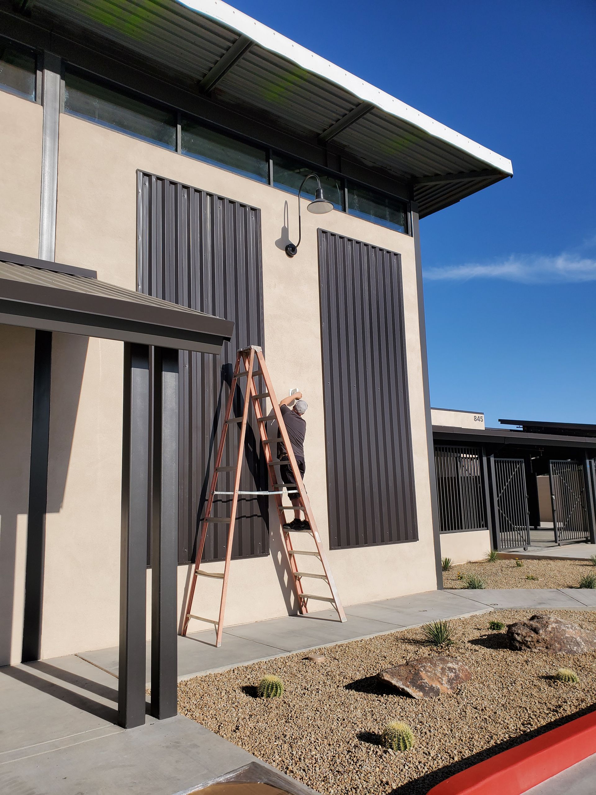 A building with a ladder on the side of it
