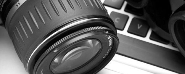 Background Investigations Camera Lens On Keyboard