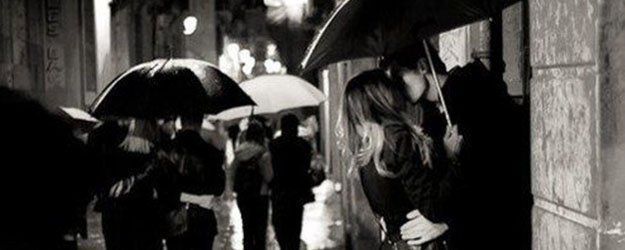 Relationships Investigations Couple Kissing Under Umbrella
