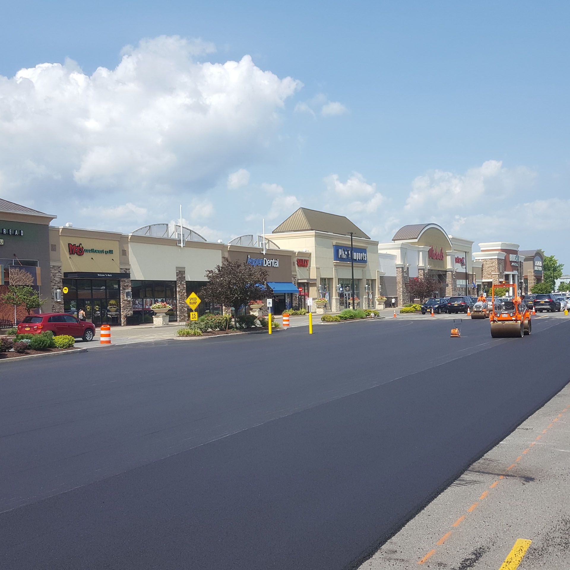 shopping center parking lot is being re-paved