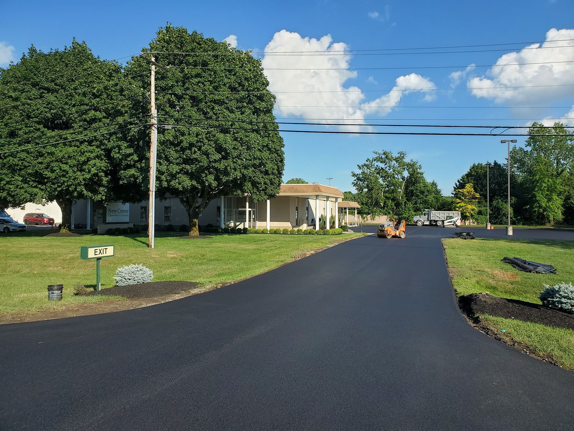 newly paved exit road and parking lot