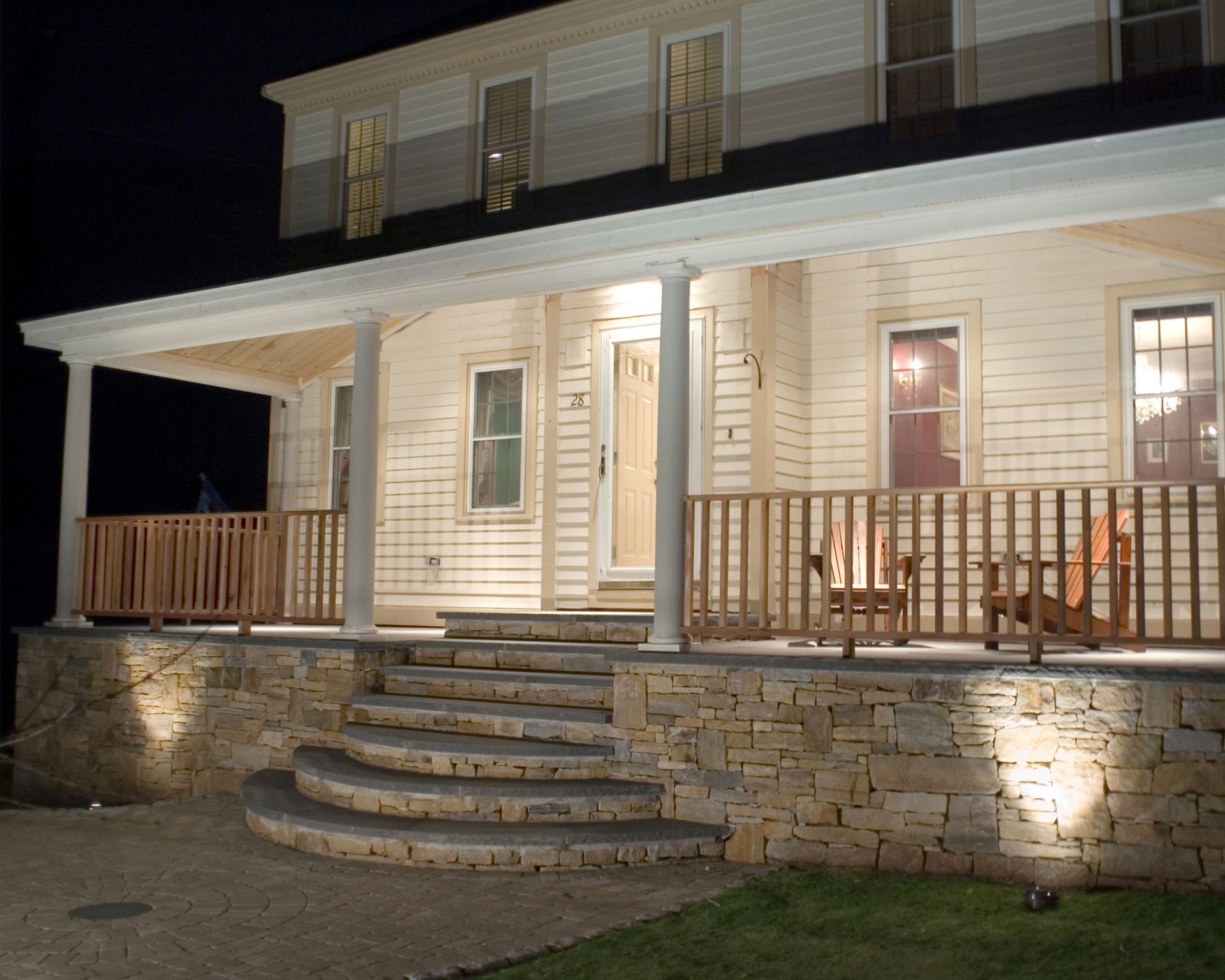 A stone driveway leading up to a house