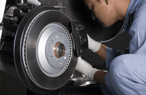 Mechanic repairing the brakes