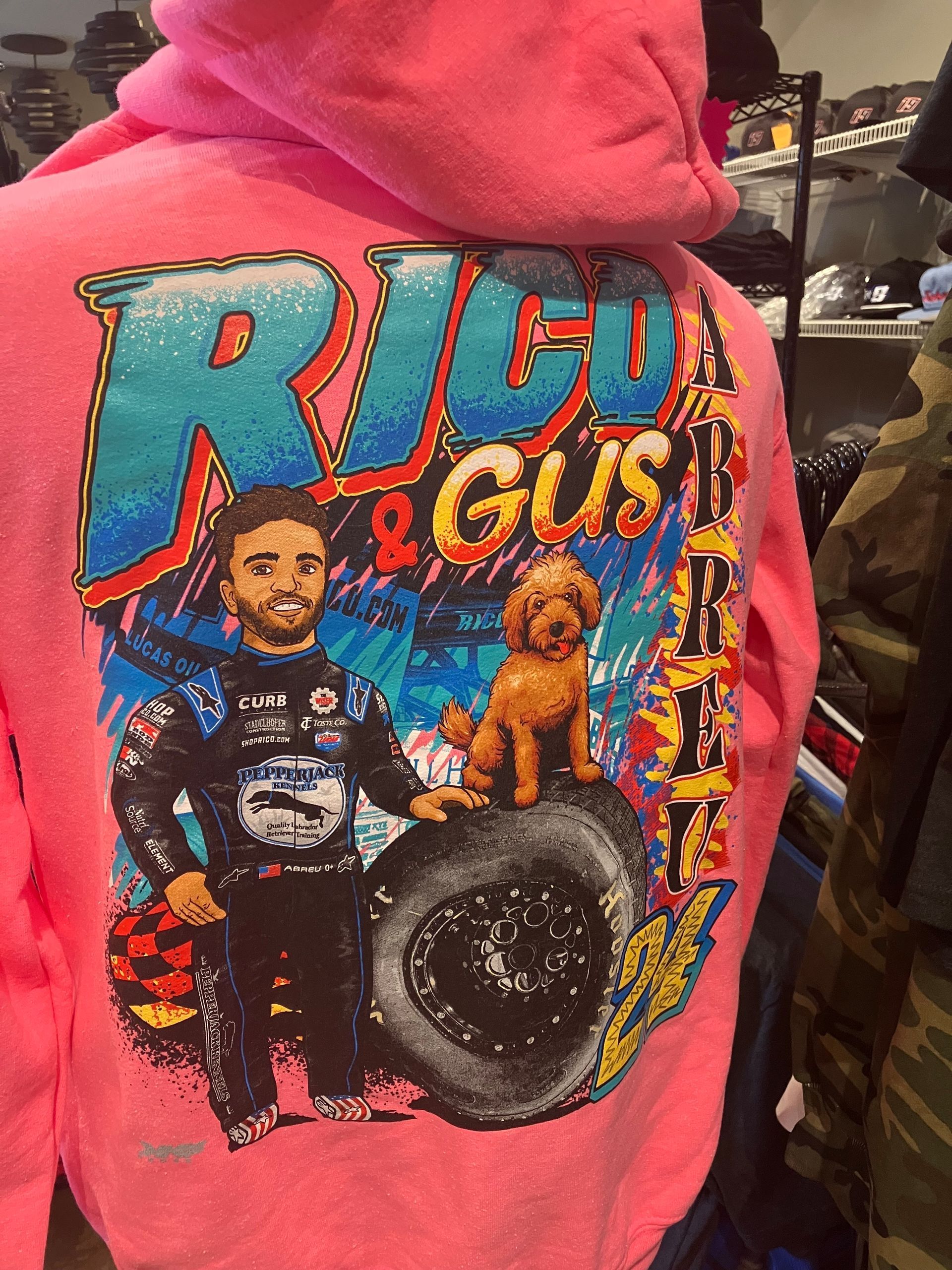 A man wearing a yellow trucker hat and glasses