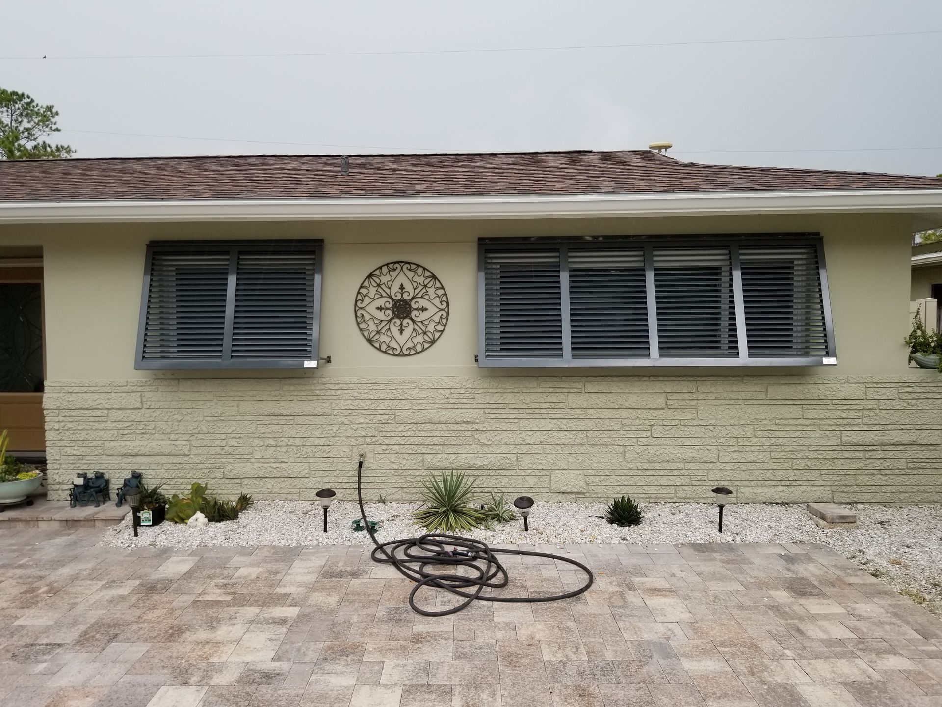 A house with a hose in front of it