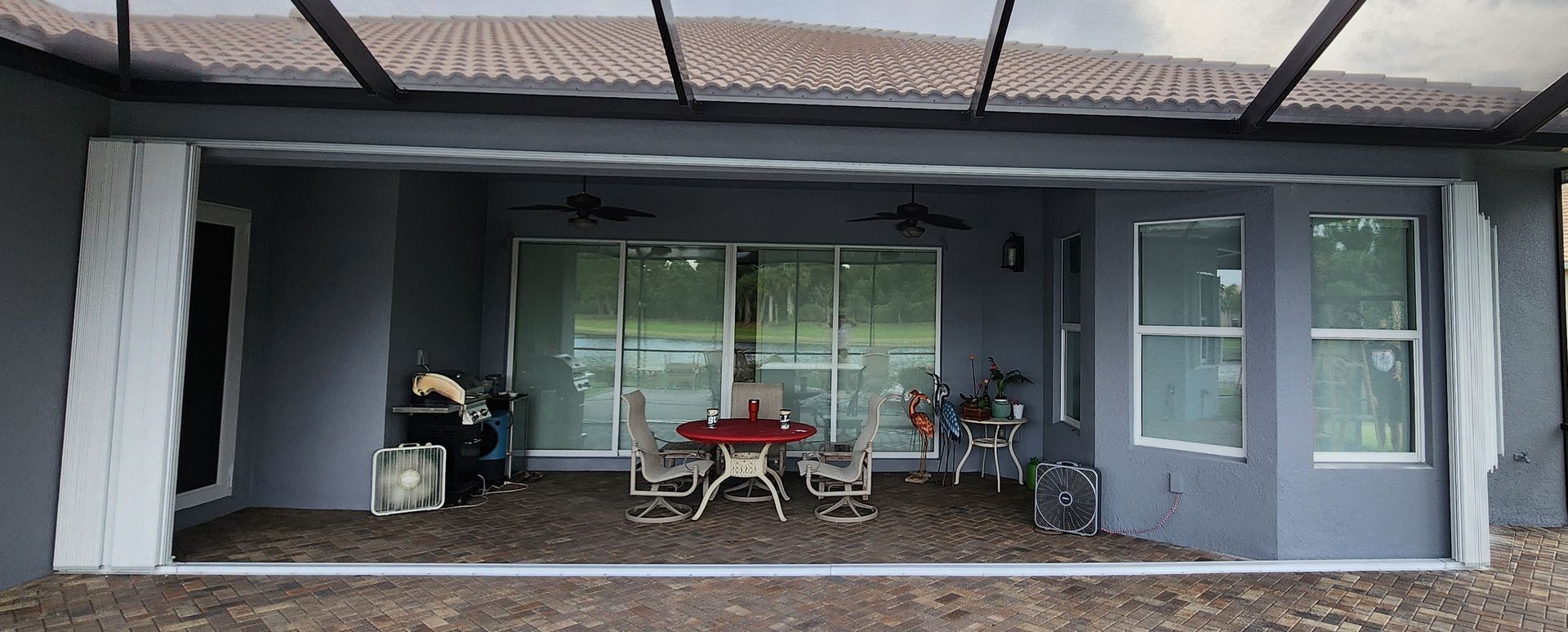 A patio with a table and chairs