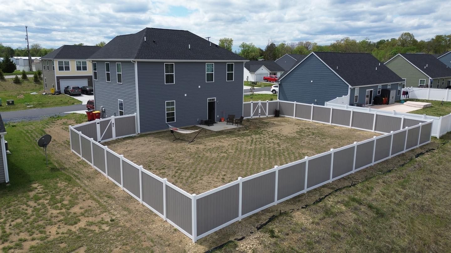 Gray and white vinyl fence