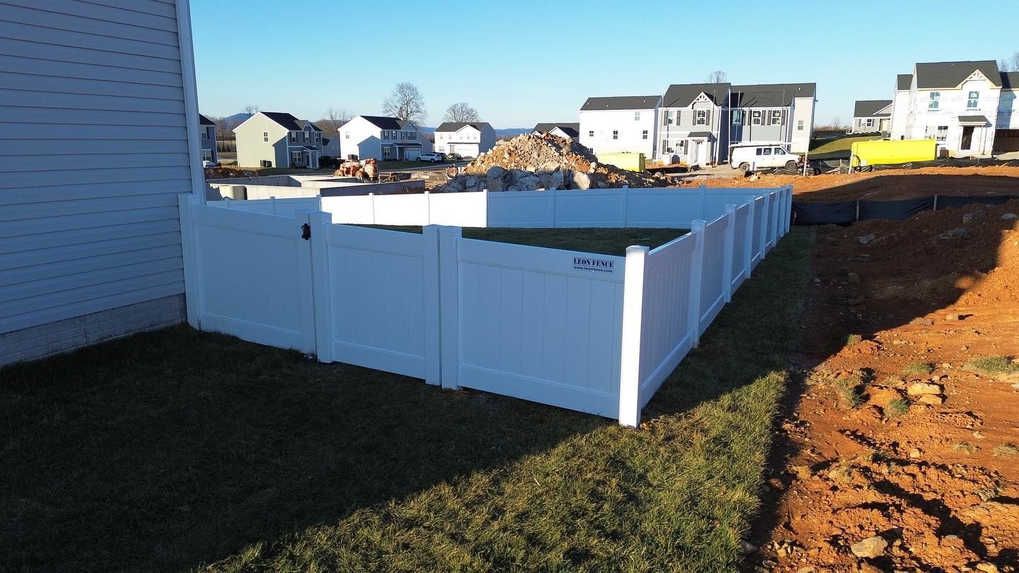 a white fence attached to a house