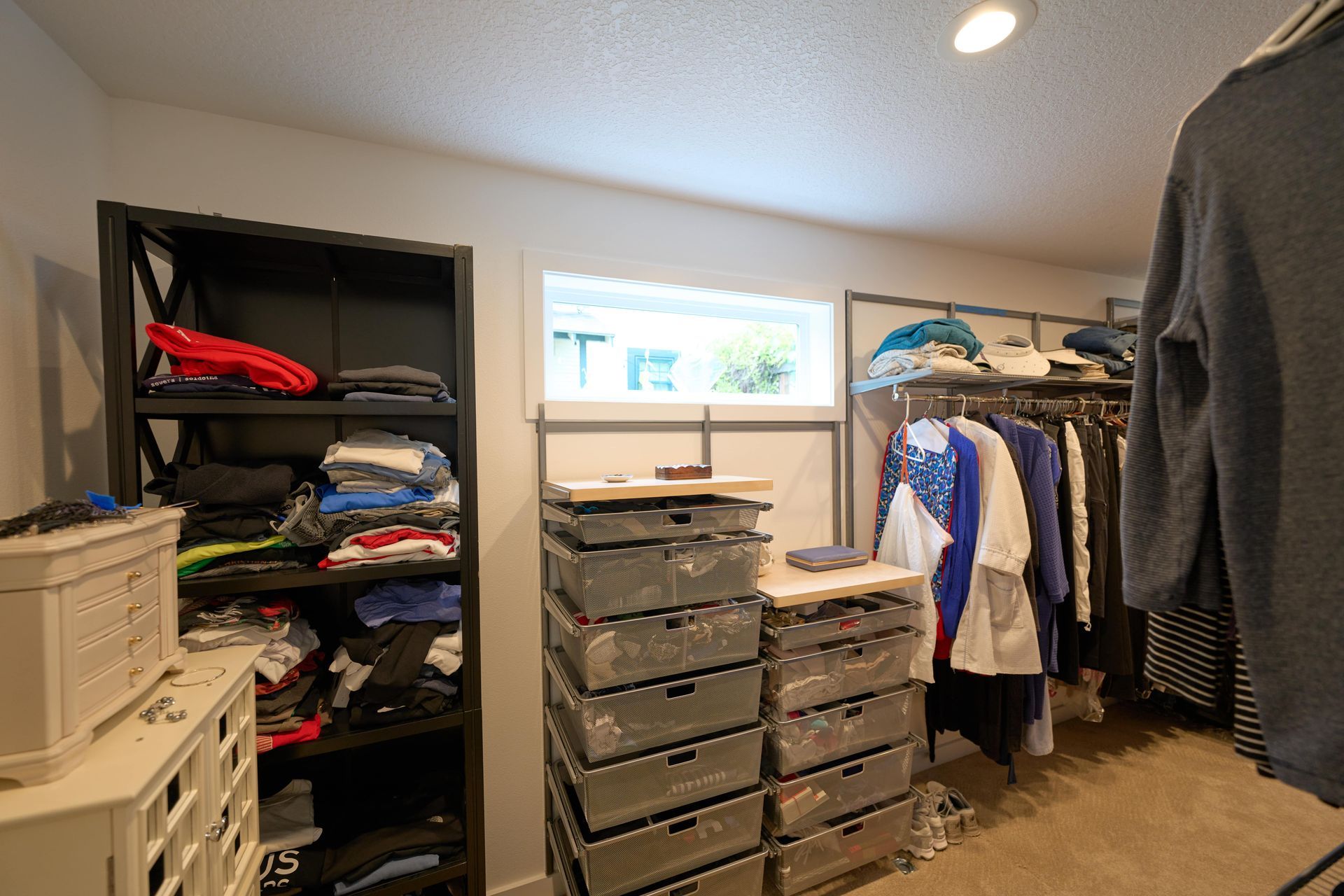 A backyard deck featuring a table surrounded by chairs, ideal for outdoor dining and relaxation.