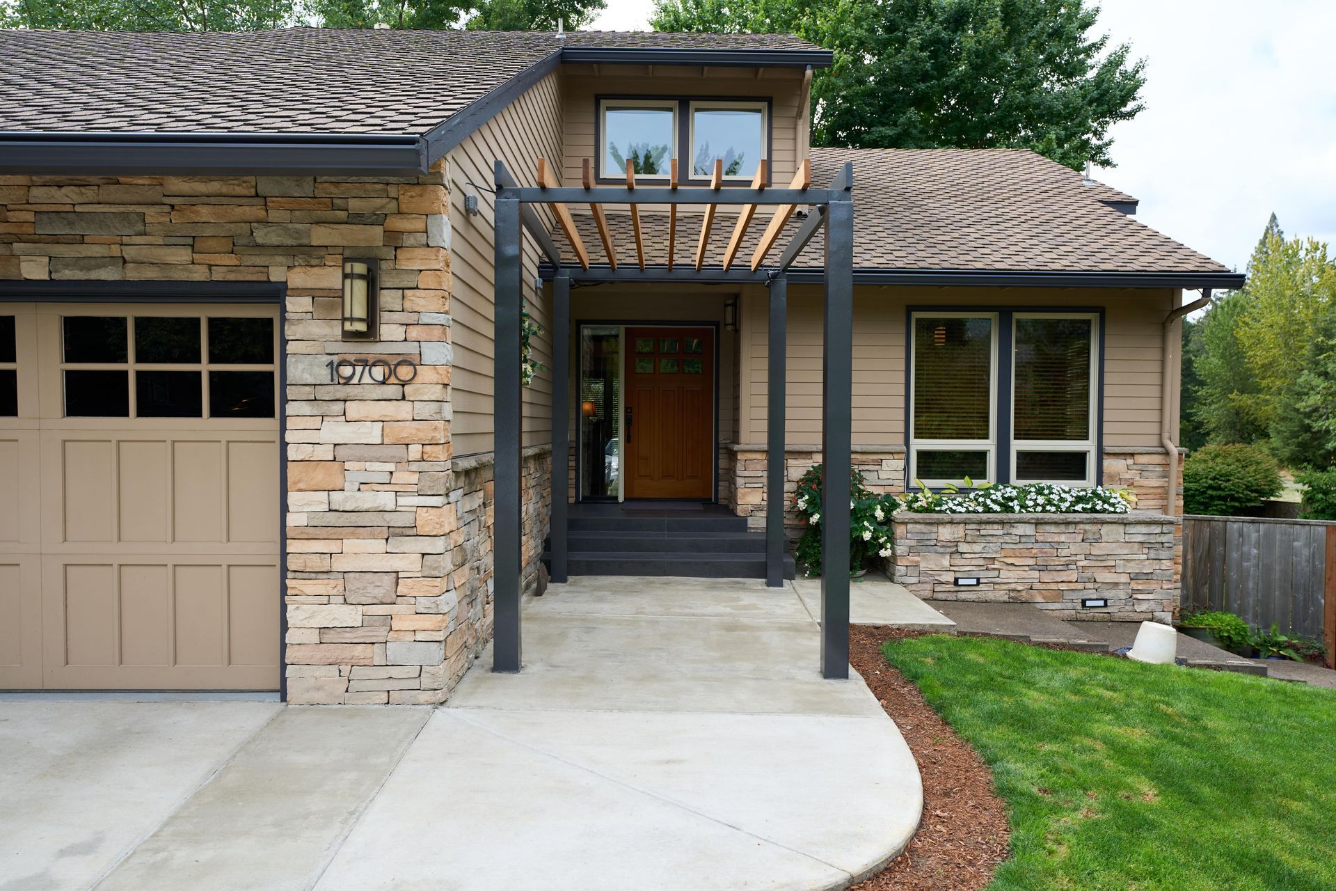 A closet filled with various clothes, accompanied by a window allowing natural light to illuminate the space.