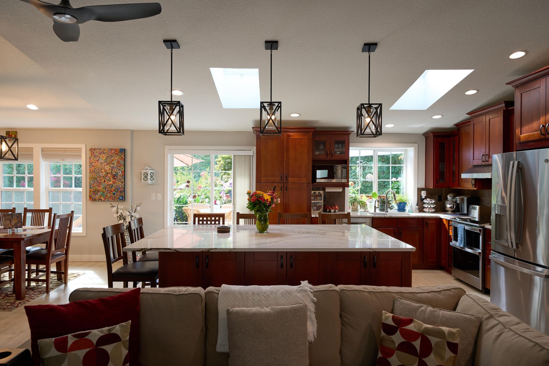 A bright kitchen showcasing a table with chairs, ideal for family meals and gatherings.