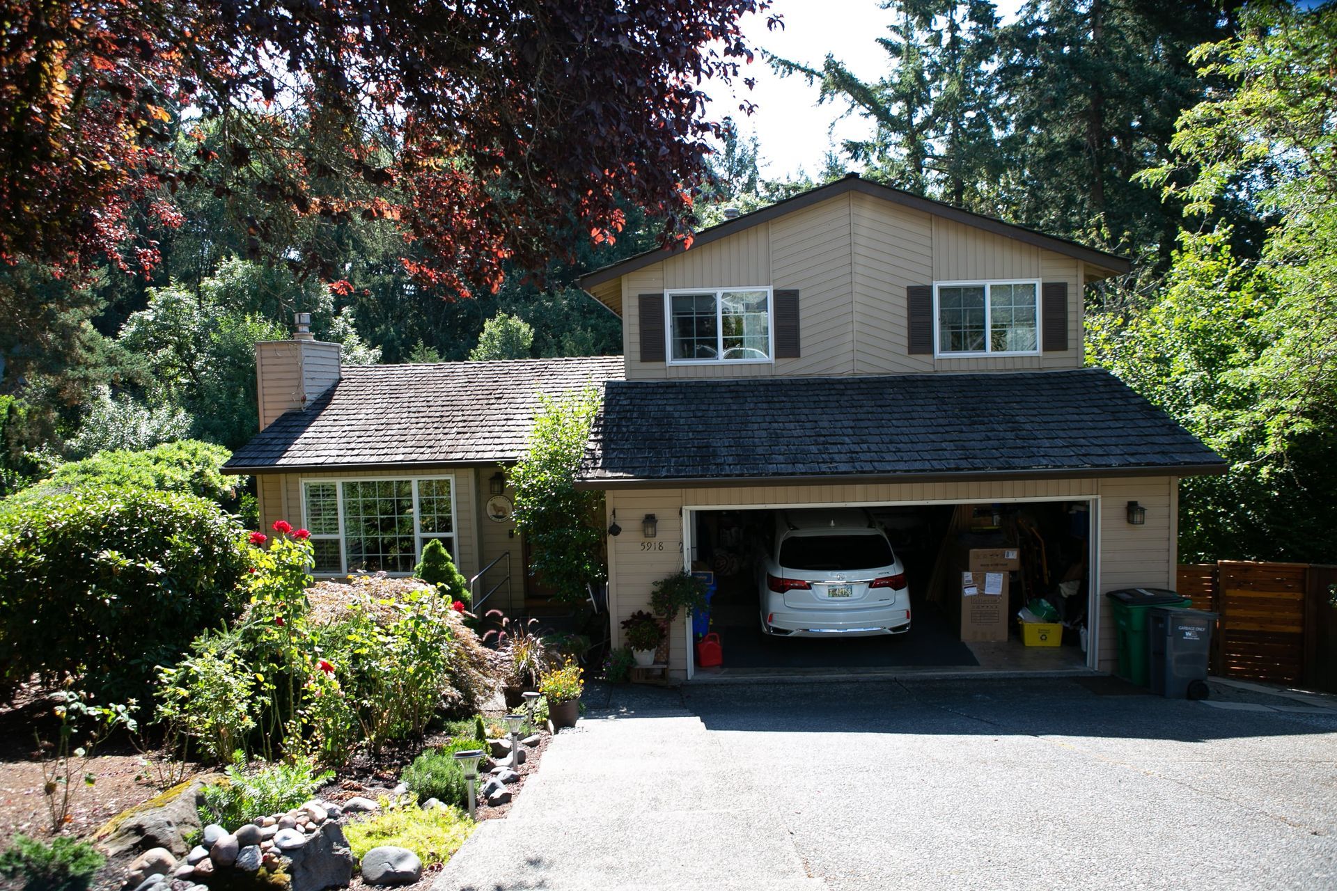 A car is parked in the garage of a house.