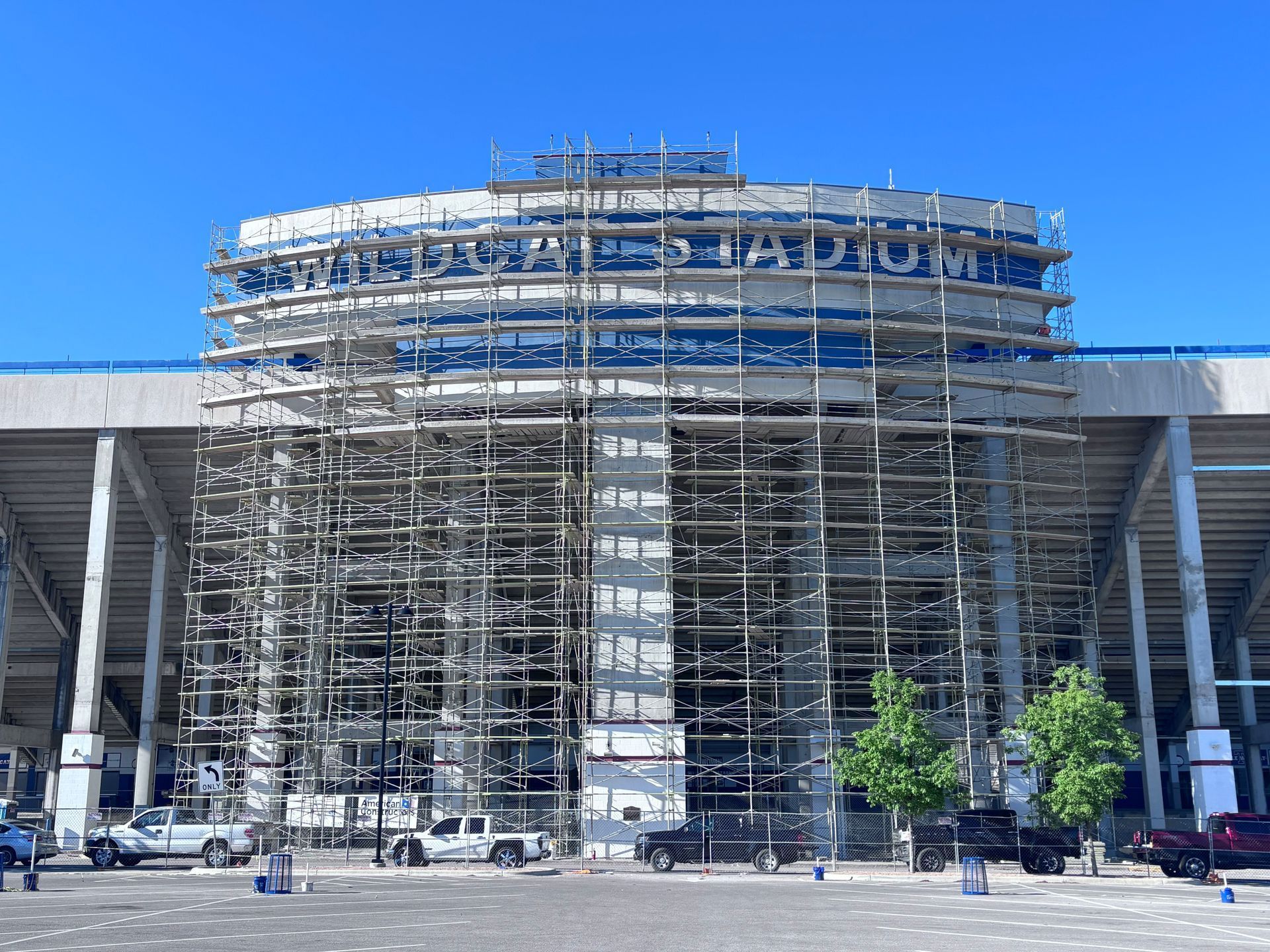 A large building with scaffolding around it is under construction.